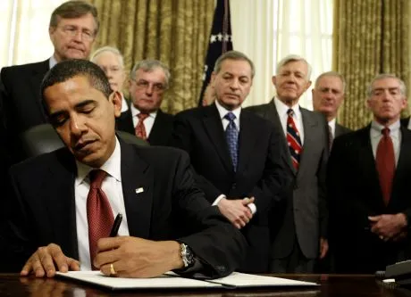 President Barack Obama signs a series of executive orders, including one closing of the prison at Guantanamo Bay, Thursday, Jan. 22, 2009, in the Oval Office of the White House in Washington. (AP Photo/Charles Dharapak)