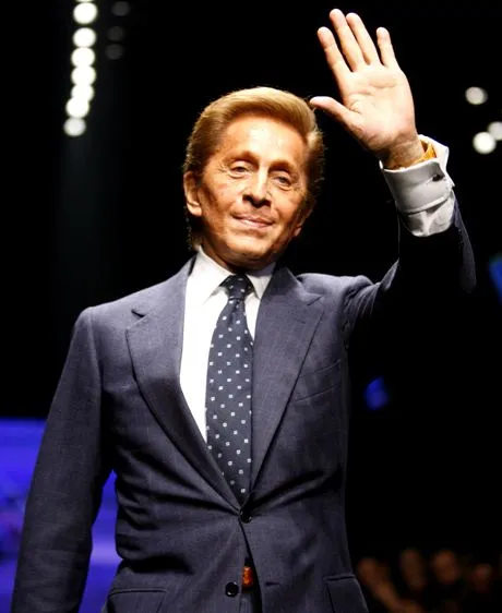 Fashion designer Valentino Garavani acknowledges the applause of the audience after presenting the Valentino Fall/Winter 2006/2007 men's fashion collection, in Milan, Italy, Wednesday, Jan. 18, 2006.